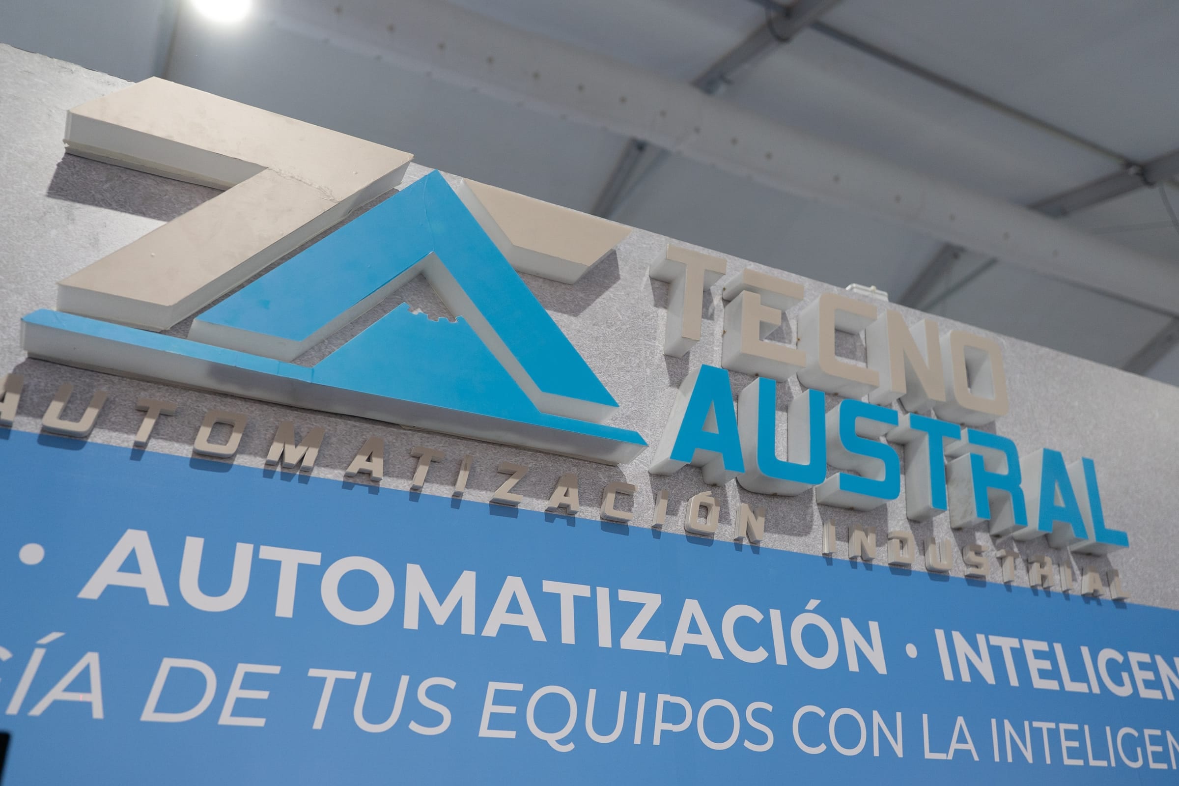 Tecnoaustral logo in relief at the booth