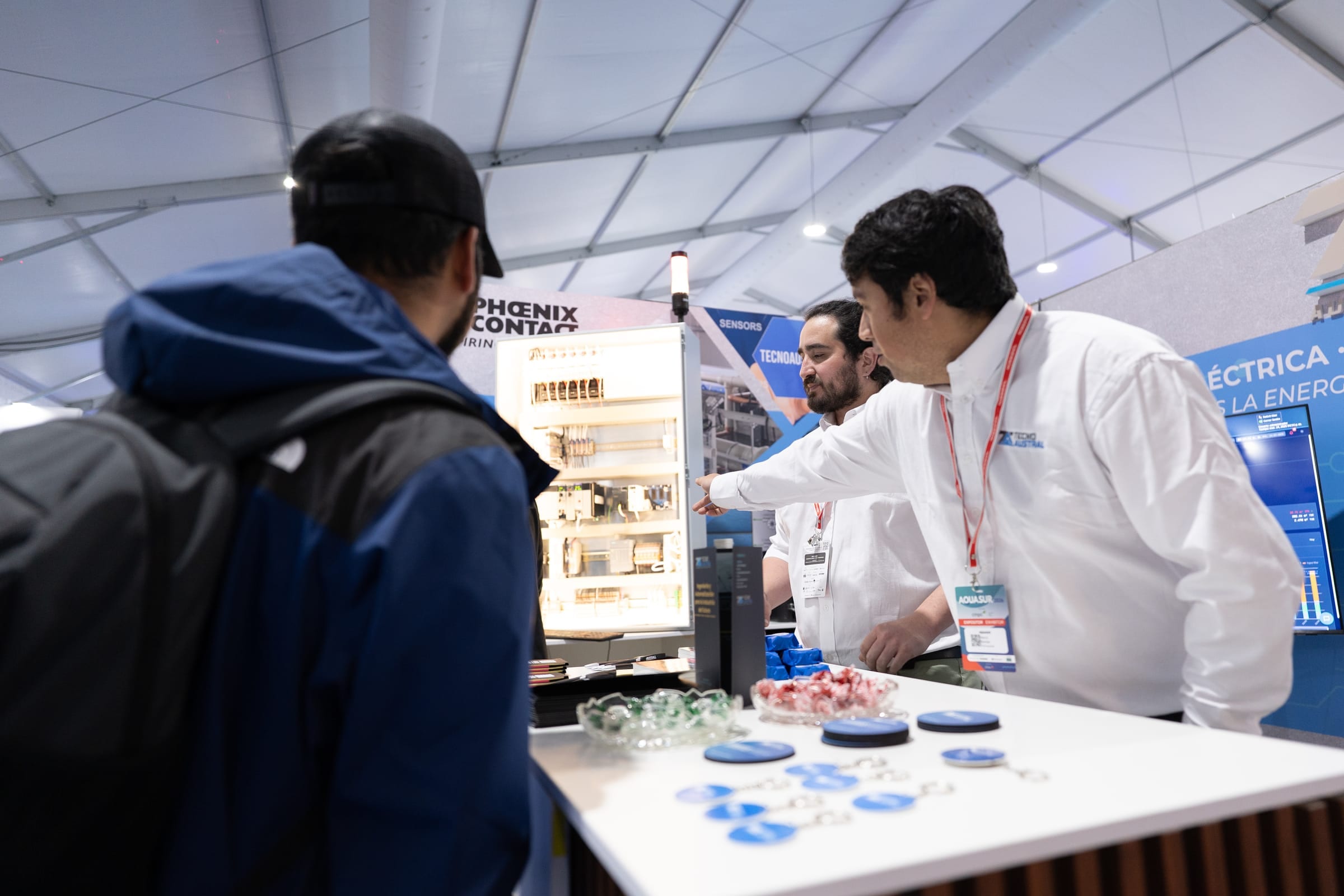 Engineer explaining automation solutions to visitors